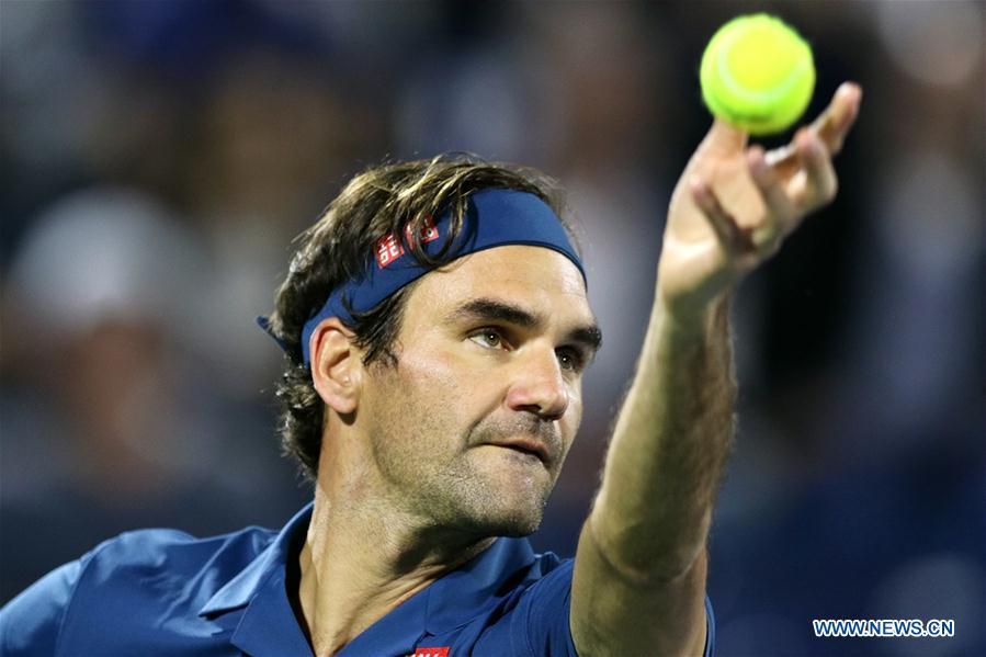 Roger Federer of Switzerland serves during the singles first round match between Roger Federer of Switzerland and Philipp Kohlschreiber of Germany at the ATP Dubai Duty Free Tennis Championships 2019 in Dubai, the United Arab Emirates, Feb. 25, 2019. Roger Federer won 2-1. (Xinhua/Mahmoud Khaled)