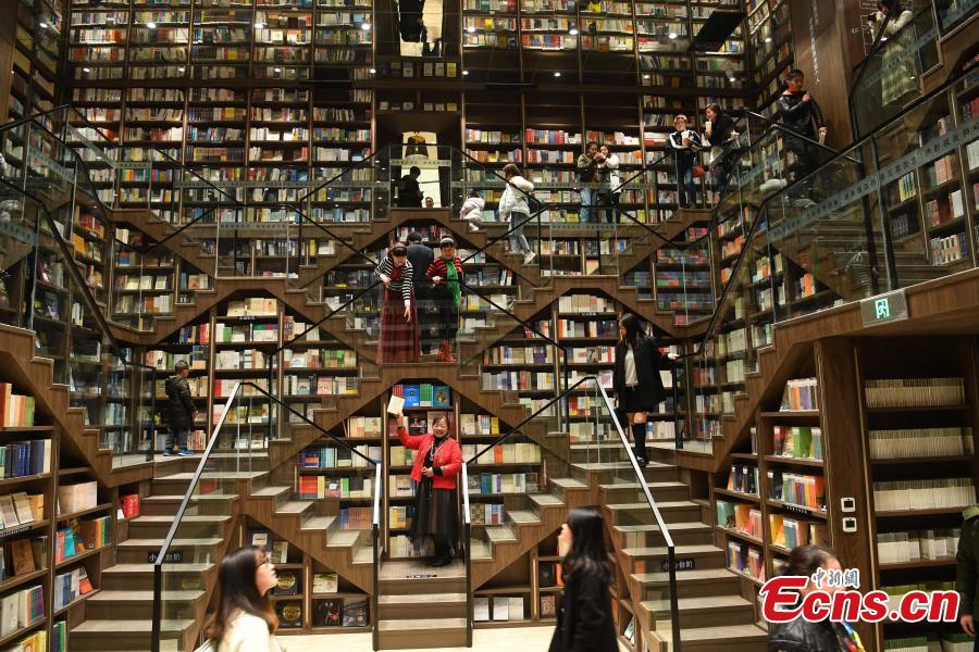 <?php echo strip_tags(addslashes(A view of the full bookshelves at a bookstore in Chongqing southwestern China, Feb. 25, 2019.   The newly opened bookstore in Chongqing southwestern China has attracted over 200,000 visitors since it opened on Jan. 25.  The store quickly gained attention for its mind-boggling interior design.  (Photo/China News Service))) ?>