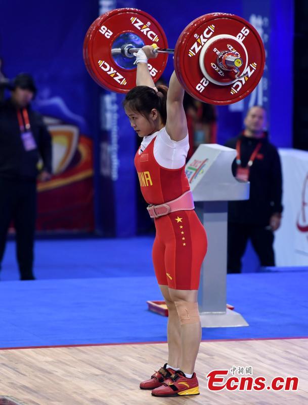 Deng Wei competes during the women\'s weightlifting 64kg event at 2019 IWF World Cup & Qualification Event For 2020 Tokyo Olympic Games in Fuzhou, southeast China\'s Fujian Province, Feb. 25, 2019. (Photo: China News Service/Zhang Bin)