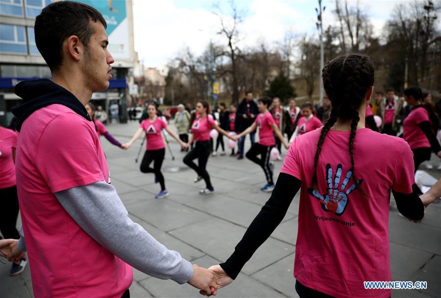 Dancers dressed in pink shirts perform a traditional dance during the Pink Shirt Day event calling for the prevention of peer violence, in Sarajevo, Bosnia and Herzegovina (BiH), on Feb. 27, 2019. The event held in the city center of Sarajevo on Wednesday attracted several hundred residents, who were informed about how to recognize the peer violence, and how to prevent it through conversation and quality time spending with a child who suffered some form of violence. (Xinhua/Nedim Grabovica)