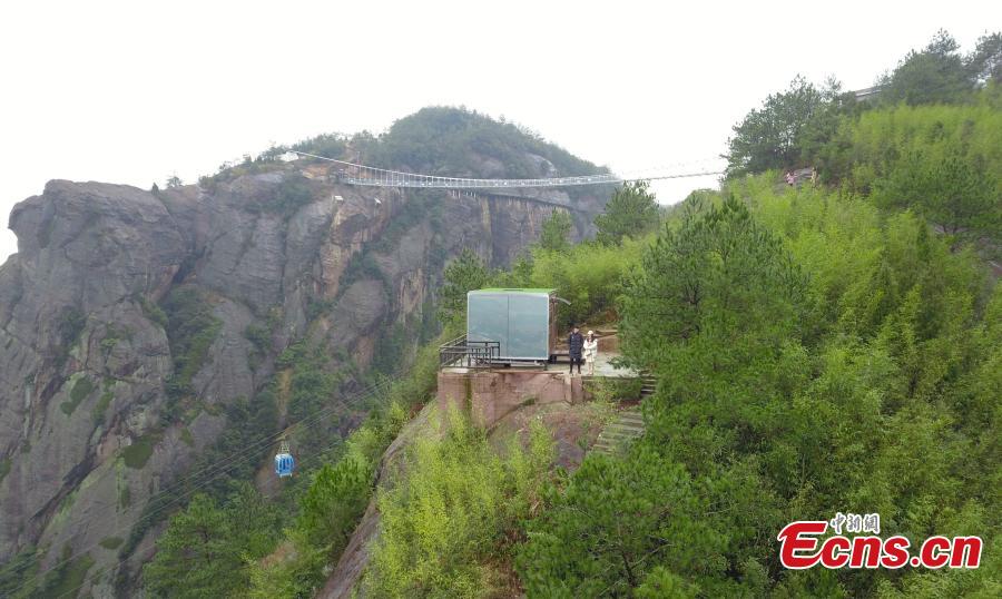 <?php echo strip_tags(addslashes(A view of a newly-opened hostel on top of a cliff, 523 meters above the ground, at the Shiniuzhai National Geological Park in Pingjiang County, Central China's Hunan Province, Feb. 27, 2019. Guests are treated to an impressive view of the park as the accommodation’s room walls are made of glass. (Photo: China News Service/Yang Huafeng))) ?>