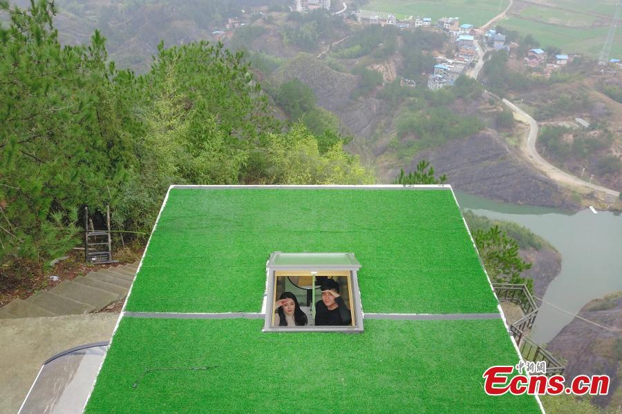 <?php echo strip_tags(addslashes(A view of a newly-opened hostel on top of a cliff, 523 meters above the ground, at the Shiniuzhai National Geological Park in Pingjiang County, Central China's Hunan Province, Feb. 27, 2019. Guests are treated to an impressive view of the park as the accommodation’s room walls are made of glass. (Photo: China News Service/Yang Huafeng))) ?>