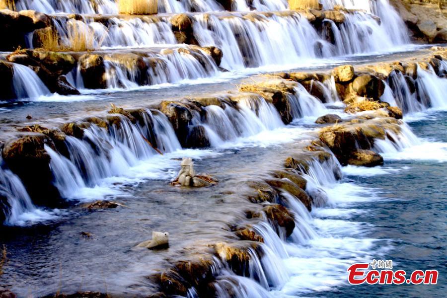 <?php echo strip_tags(addslashes(Melting snow in the Qilian Mountains caused water levels to rise in a river, forming a beautiful series of natural waterfalls in Zhangye City, Gansu Province as temperatures rose in late February. (Photo: China News Service/Chen Li))) ?>