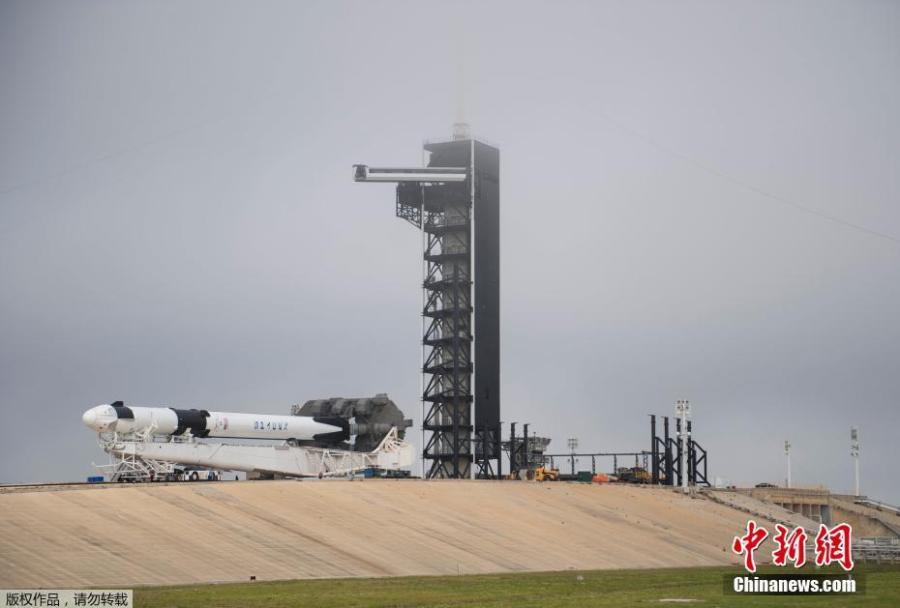 A SpaceX Falcon 9 rocket with the company\'s Crew Dragon spacecraft onboard is seen as it is rolled to the launch pad at Launch Complex 39A as preparations continue for the Demo-1 mission, Feb. 28, 2019 at NASA\'s Kennedy Space Center in Florida. The Demo-1 mission will be the first launch of a commercially built and operated American spacecraft and space system designed for humans as part of NASA\'s Commercial Crew Program. (Photo/Agencies)
