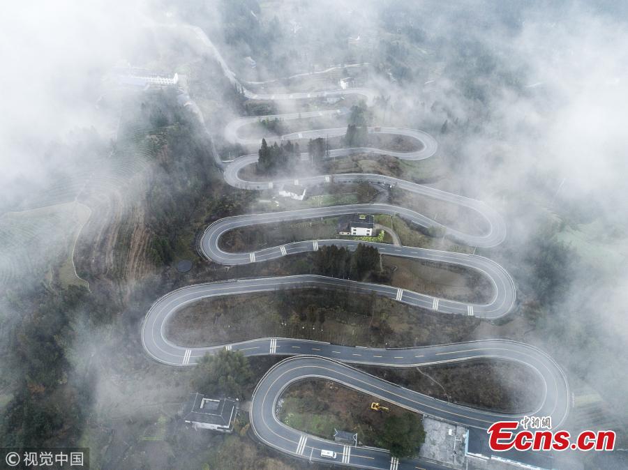 <?php echo strip_tags(addslashes(A winding mountain road, which has become a tourist attraction for its ten bends, is shrouded in mist in Taiyanghe Township, Enshi Tujia and Miao Autonomous Prefecture, Hubei Province, March 3, 2019. (Photo/VCG))) ?>