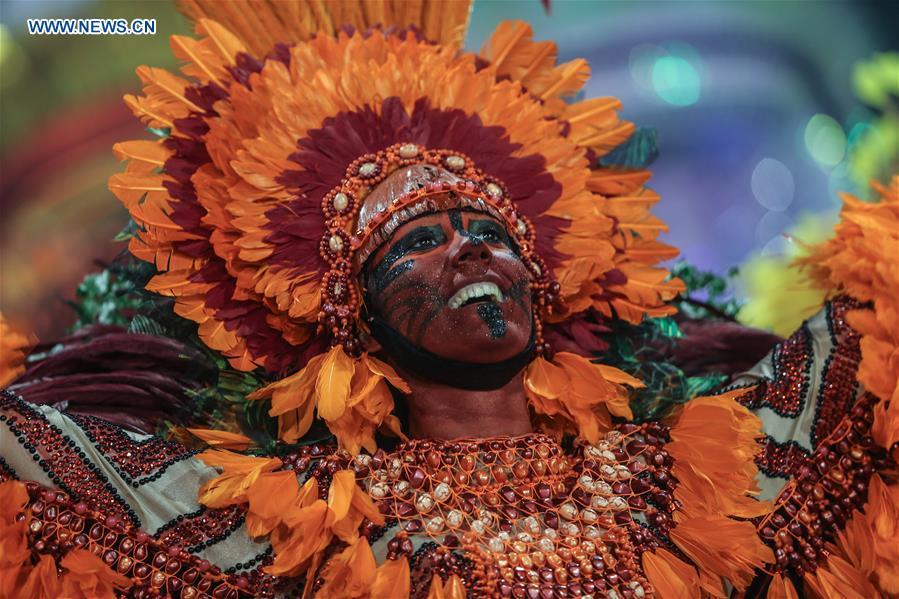 A reveller from a samba school performs during the carnival parade in Sao Paulo, Brazil, March 3, 2019. (Xinhua/Rahel Patrasso)