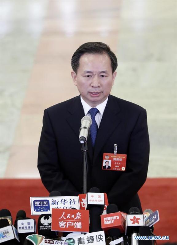 Li Ganjie, minister of ecology and environment, receives an interview after the opening meeting of the second session of the 13th National Committee of the Chinese People\'s Political Consultative Conference (CPPCC) at the Great Hall of the People in Beijing, capital of China, March 3, 2019. (Xinhua/Shen Bohan)
