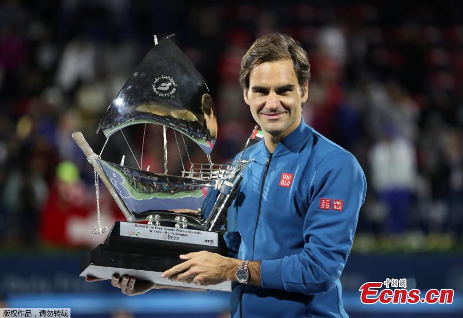 Roger Federer of Switzerland holds his trophy after winning the final match at the Dubai Duty Free Tennis Championship against Stefanos Tsitsipas of Greece, in Dubai, United Arab Emirates, March 2, 2019. Roger Federer claimed the 100th ATP title of his career by beating 20-year-old Greek Stefanos Tsitsipas 6-4 6-4. The 20-times Grand Slam champion became the second man in the Open Era to win 100 titles, after American Jimmy Connors who won 109. (Photo/Agencies)