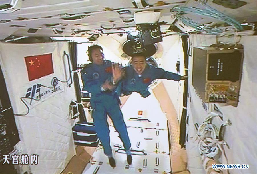 <?php echo strip_tags(addslashes(The screen at the Beijing Aerospace Control Center shows the two Chinese astronauts Jing Haipeng (L) and Chen Dong entering the space lab Tiangong-2, Oct. 19, 2016. The China Manned Space Engineering Office (CMSEO) announced Monday that the core module of the country's space station, the Long March-5B carrier rocket and its payloads will be sent to the launch site in the second half of this year, to make preparations for the space station missions. China is scheduled to complete the construction of the space station around 2022. It will be the country's space lab in long-term stable in-orbit operation. (Xinhua/Ju Zhenhua))) ?>