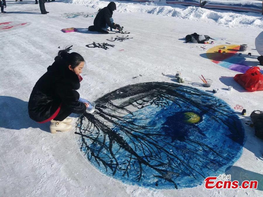 Paintings adorn the ground during an ice and snow festival in the Aoluguya Ewenki ethnic township in the Inner Mongolia Autonomous Region, March 5, 2019. The paintings depict the customs and natural landscape of the township, home to China\'s only reindeer-herding tribe. (Photo: China News Service/Zheng Wei and Deng Hongpeng)