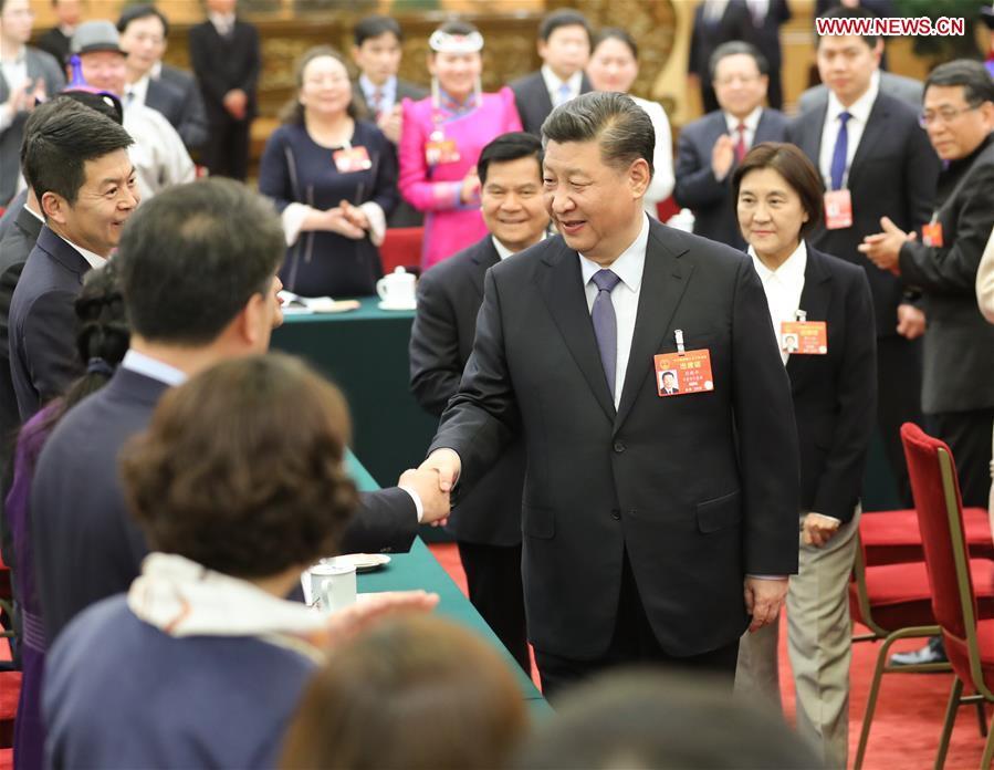 Chinese President Xi Jinping, also general secretary of the Communist Party of China (CPC) Central Committee and chairman of the Central Military Commission, attends a panel discussion with his fellow deputies from Inner Mongolia Autonomous Region at the second session of the 13th National People\'s Congress in Beijing, capital of China, March 5, 2019. (Xinhua/Ju Peng)
