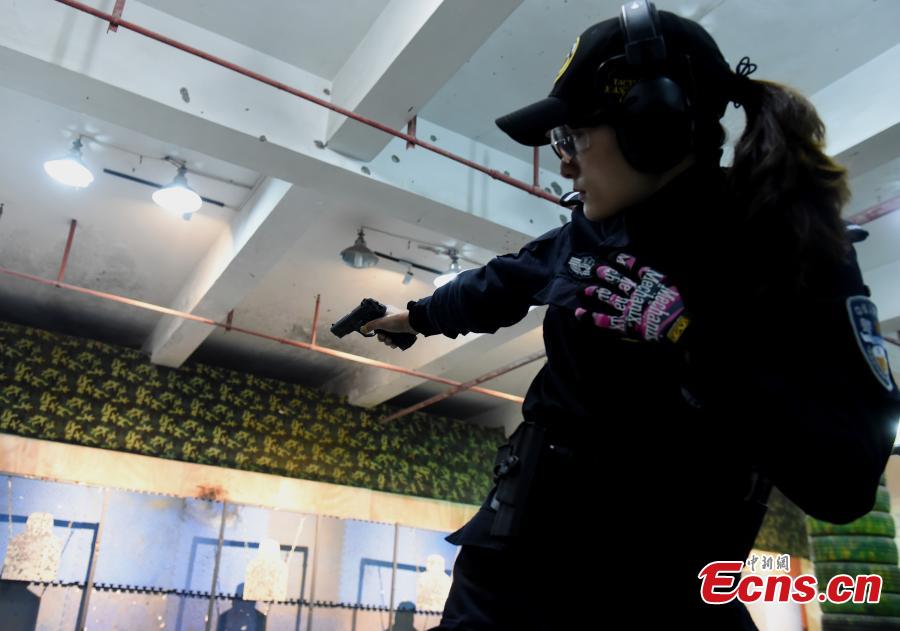 Members of a female special police taskforce of the Chongqing Public Security Bureau show their skills, including combat and firearm use, in an open day event on March 6, 2019, as part of activities to mark International Women\'s Day on March 8. (Photo: China News Service/Zhou Yi)