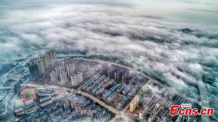 A drone photo taken on March 5, 2019 shows the skyline of Wuning County in Jiangxi Province under heavy fog. (Photo: China News Service/Luo Xingang)