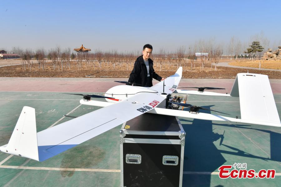 A drone put into use by Chengguan, urban management officers, in Shijiazhuang City, Hebei Province, March 7, 2019. The drone, with a wingspan of four meters, is used to take aerial photos of an area 138 square kilometres in size, to aid Chengguan in spotting open-air garbage and unapproved construction. (Photo: China News Service/Zhai Yujia)