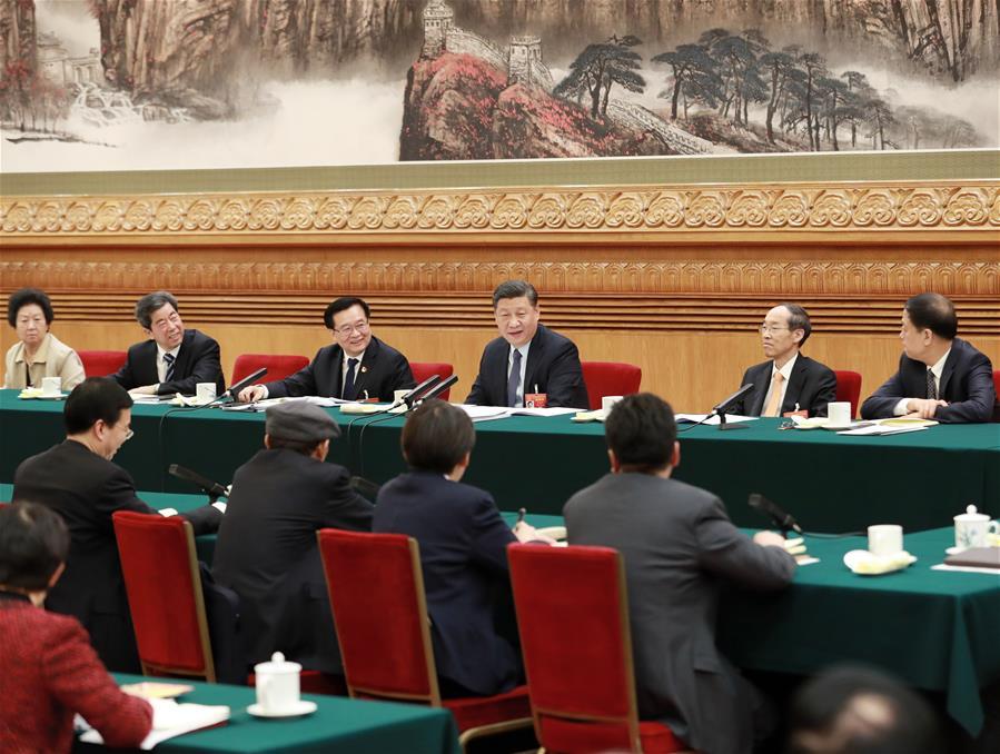 Chinese President Xi Jinping, also general secretary of the Communist Party of China (CPC) Central Committee and chairman of the Central Military Commission, joins deliberation with deputies from central China\'s Henan Province at the second session of the 13th National People\'s Congress in Beijing, capital of China, March 8, 2019. (Xinhua/Pang Xinglei)