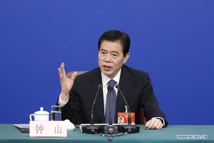 China\'s Minister of Commerce Zhong Shan attends a press conference on China\'s domestic market and all-round opening-up for the second session of the 13th National People\'s Congress (NPC) in Beijing, capital of China, March 9, 2019. (Xinhua/Shen Bohan)