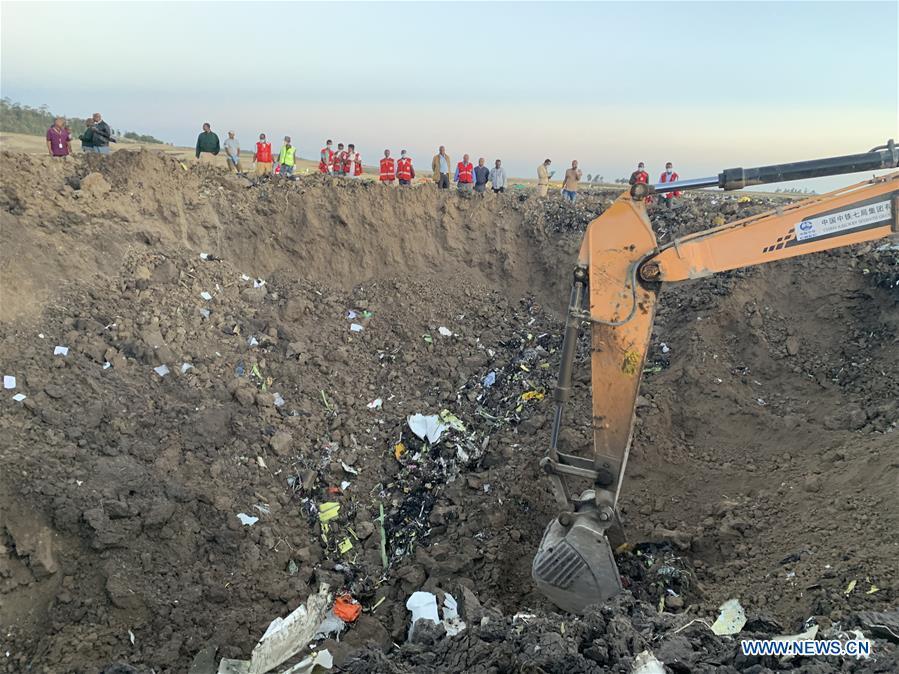 An excavator works at the crash site of an Ethiopian Airlines\' aircraft, some 50 km east of Addis Ababa, capital of Ethiopia, on March 10, 2019. All 157 people aboard Ethiopian Airlines flight were confirmed dead as Africa\'s fastest growing airline witnessed the worst-ever incident in its history. The incident on Sunday, which involved a Boeing 737-800 MAX, occurred a few minutes after the aircraft took off from Addis Ababa Bole International Airport to Nairobi, Kenya. It crashed around Bishoftu town, the airline said. (Xinhua/Wang Shoubao)