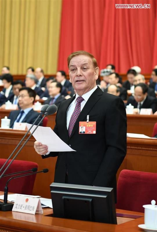 <?php echo strip_tags(addslashes(Arken Imirbaki presides over the third plenary meeting of the second session of the 13th National People's Congress (NPC) at the Great Hall of the People in Beijing, capital of China, March 12, 2019. (Xinhua/Xie Huanchi))) ?>