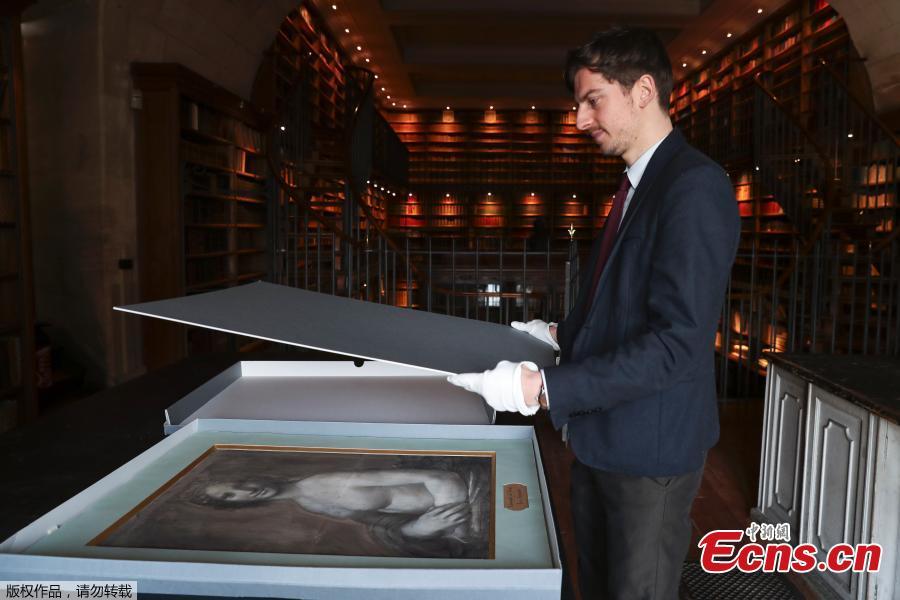 <?php echo strip_tags(addslashes(Curator at the Conde Museum Mathieu Deldicque handles a charcoal drawing known as the 