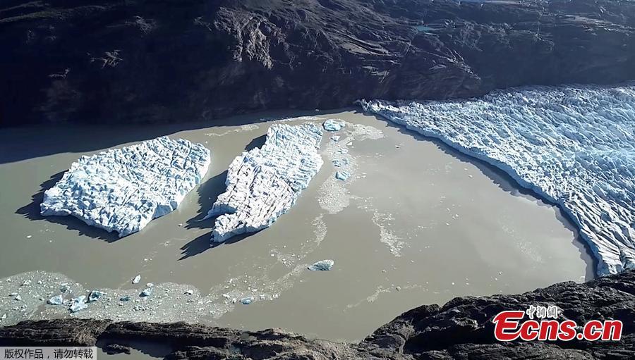 <?php echo strip_tags(addslashes(Two new icebergs are seen after breaking off from the Grey glacier in Patagonia, Chile March 9, 2019. The breaks, which occurred on Feb. 20 and March 7, came after a larger block of ice the size of three soccer fields, (380 meters by 350 meters, separated from the glacier, which sits in a glacial lake in Torres del Paine National Park in southern Chile, in November 2017. The break aroused fears that such ruptures are becoming more frequent. (Photo/Agencies))) ?>