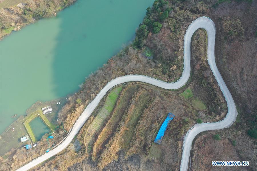 <?php echo strip_tags(addslashes(Aerial Photo taken on March 12, 2019 shows the winding concrete road at Wengnong Village of Laotun Township in Taijiang County, Miao and Dong Autonomous Prefecture of Qiandongnan, southwest China's Guizhou Province. The concrete road project in Guizhou was launched in August, 2017. Up to now, Guizhou has seen 77,700 kilometers of rural roads built or renovated with nearly 40,000 villages connected by concrete roads. Tens of millions of rural people benefit from the project. (Xinhua/Ouyang Guanglin))) ?>