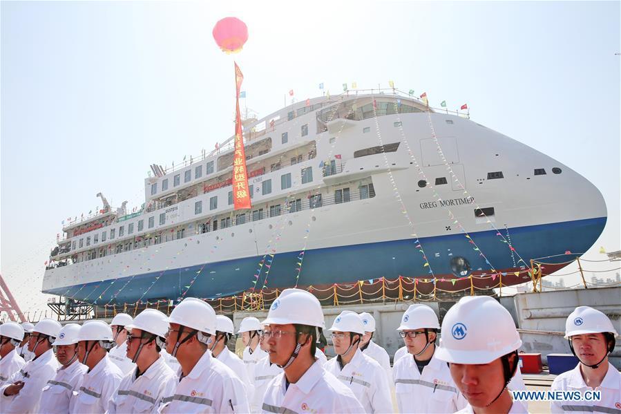 Photo taken on March 12, 2019 shows the launching ceremony of the first China-made cruise ship for polar expeditions, held in Haimen, east China\'s Jiangsu Province. The first China-made cruise ship for polar expeditions tested the water on Tuesday in Haimen, east China\'s Jiangsu Province. Hu Xianfu, general manager of the shipbuilder China Merchants Group, said the 104.4-meters long vessel is 18.4 meters at the beam. It can operate at a speed of 15.5 knots. With a gross tonnage of 7,400 tonnes, it can accommodate 255 people on board. (Xinhua/Xu Congjun)