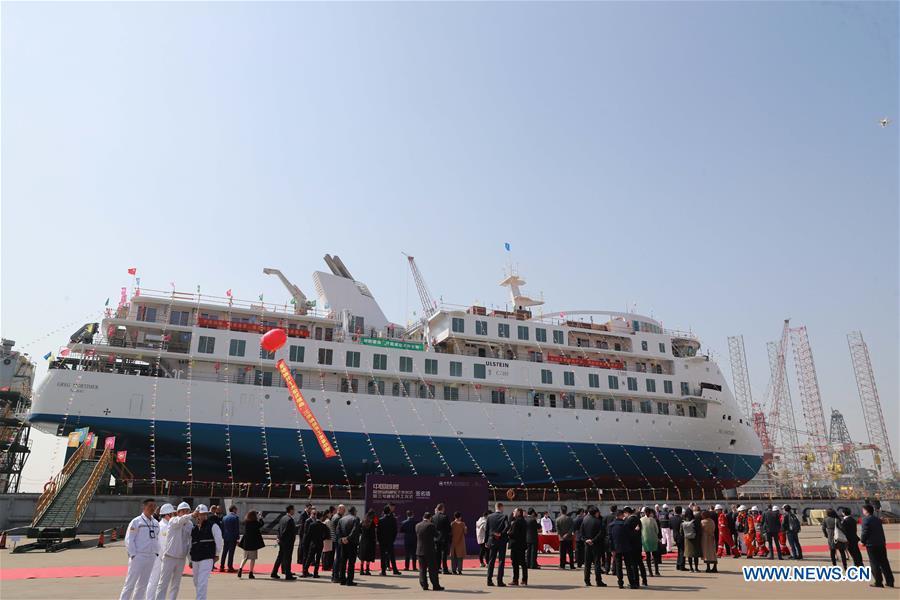 Photo taken on March 12, 2019 shows the launching ceremony of the first China-made cruise ship for polar expeditions, held in Haimen, east China\'s Jiangsu Province. The first China-made cruise ship for polar expeditions tested the water on Tuesday in Haimen, east China\'s Jiangsu Province. Hu Xianfu, general manager of the shipbuilder China Merchants Group, said the 104.4-meters long vessel is 18.4 meters at the beam. It can operate at a speed of 15.5 knots. With a gross tonnage of 7,400 tonnes, it can accommodate 255 people on board. (Xinhua/Xia Jifu)