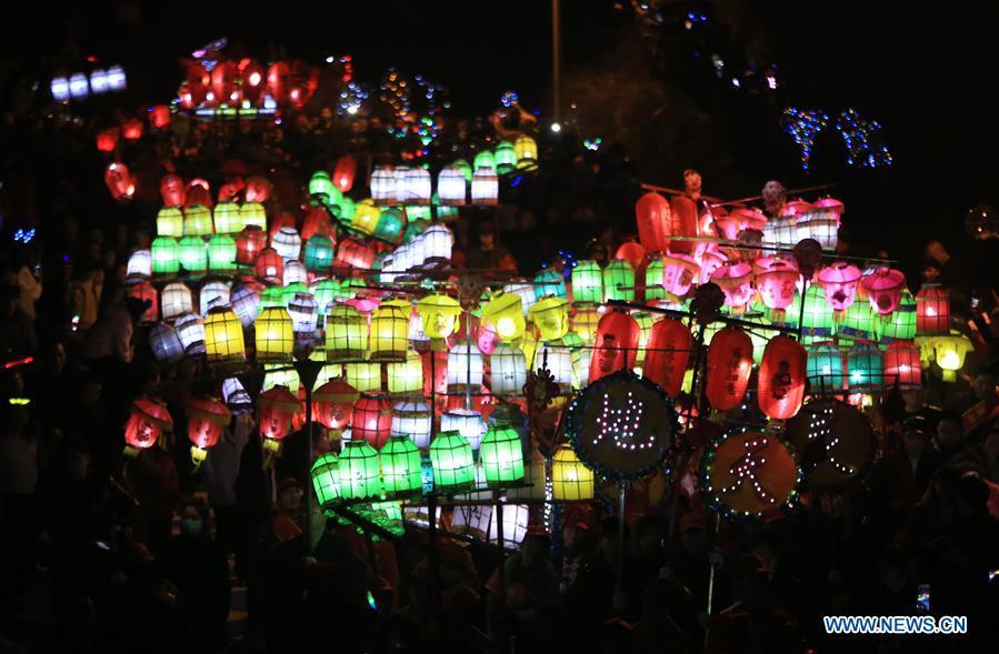 People holding colorful lanterns take part in the celebration of Huodeng Festival in Jiepai Town of Hengyang County, central China\'s Hunan Province, March 13, 2019. The Huodeng Festival was held here to wish for good luck in the new year. (Xinhua/Liu Xinrong)