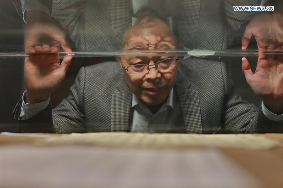 <?php echo strip_tags(addslashes(Wang Zongxun, curator of a museum of Jinping Writs, checks the document on display at the museum in Jinping County, southwest China's Guizhou Province, March 18, 2019. Dating back to the Ming Dynasty (1368-1644), 