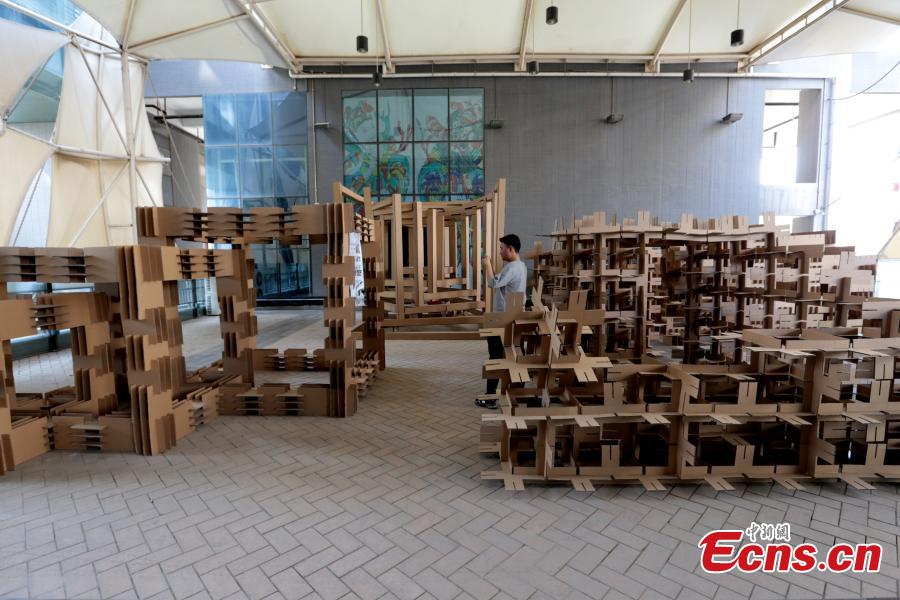 Art installations made using carton board are on display at the Museum of Xi\'an Jiaotong University in Xi\'an City, Shaanxi Province, March 18, 2019. Students used carton board to form small creations that feature ideas such as time travel. (Photo: China News Service/Zhang Yuan)