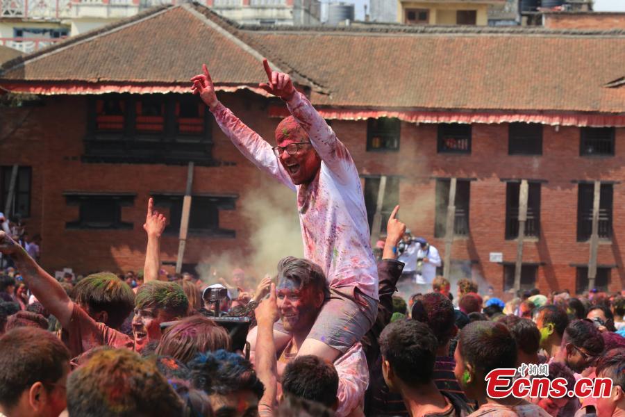 <?php echo strip_tags(addslashes(People celebrate Holi, the Festival of Colours, in Kathmandu, Nepal, March 20, 2019. Revellers, young and old, alike, celebrated the festival by smearing colourful powders and throwing colours and water to each other. (Photo: China News Service/Zhang Chenyi))) ?>
