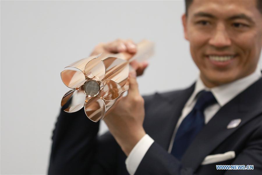 <?php echo strip_tags(addslashes(Tokyo 2020 Torch Relay Ambassador, Japanese athlete Tadahiro Nomura shows the design of the Tokyo 2020 Olympic Torch in Tokyo, Japan, on March 20, 2019. The Tokyo Organising Committee of the Olympic and Paralympic Games (Tokyo 2020) unveiled the prototype of the Tokyo 2020 Olympic Torch on Wednesday. The motif of Tokyo 2020 Olympic Torch is cherry blossom. Aluminum recycled from temporary housing used in areas struck by the Great East Japan Earthquake disaster will be used to manufacture the torch. (Xinhua/Du Xiaoyi))) ?>
