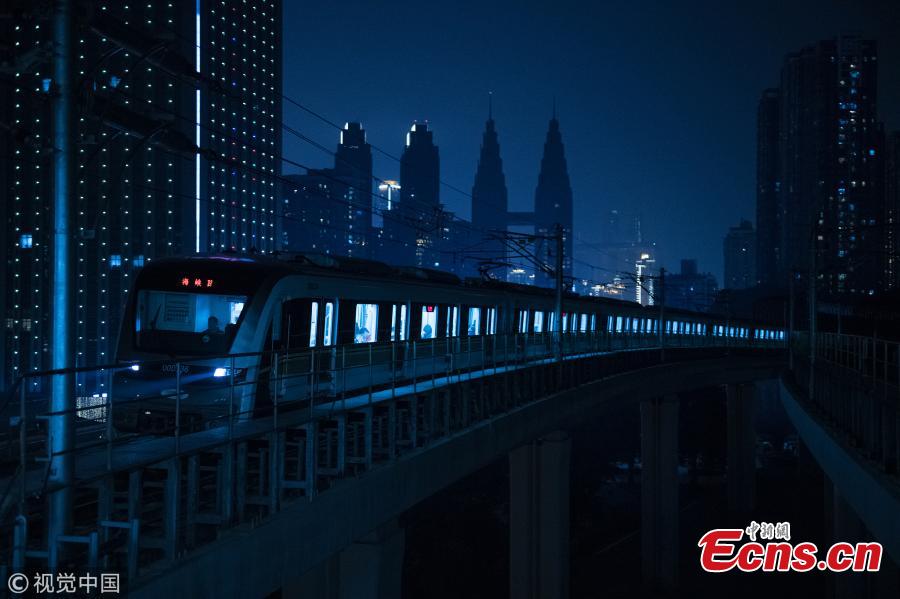 <?php echo strip_tags(addslashes(Photo shows a train leaving a subway station in Southwest China's Chongqing, on March 11, 2019. Haitangxi Station, a light rail station on a loop line in Chongqing, became popular online for its vibrant appearance at night.  (Photo/VCG))) ?>