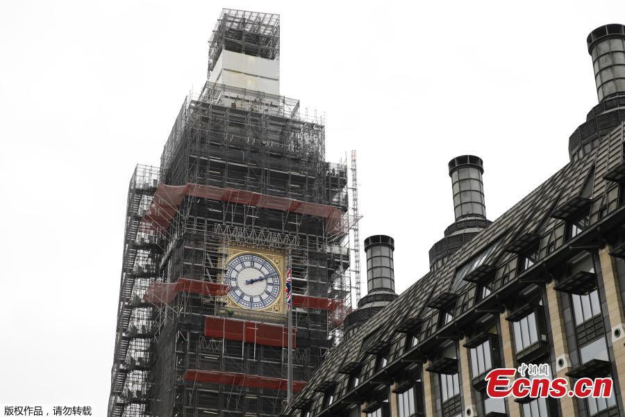 Photo taken on March 22, 2019 shows part of the clock tower revealed for the first time since restoration work began in 2017. And it shows a mostly blue face. (Photo/Agencies)