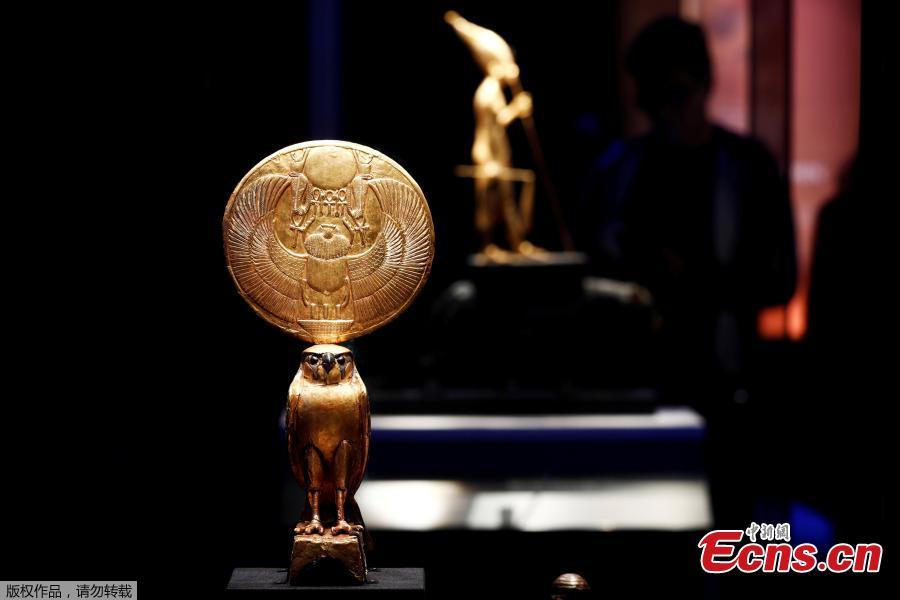 A gilded wooden hawk with solar disk is pictured during a press visit of the Tutankhamun, Treasures of the Golden Pharaoh exhibition, displaying more than 150 original artefacts, at the Grande Halle de la Villette in Paris, France, March 21, 2019. (Photo/Agencies)