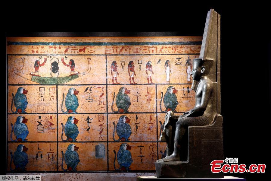 The god Amun protecting Tutankhamun is pictured during a press visit of the Tutankhamun, Treasures of the Golden Pharaoh exhibition, displaying more than 150 original artefacts, at the Grande Halle de la Villette in Paris, France, March 21, 2019. (Photo/Agencies)