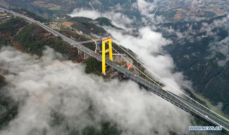 This aerial photo taken on March 23, 2019 shows the Siduhe Bridge on the Shanghai-Chongqing Highway in Yesanguan Town of Badong County in Enshi Tujia and Miao Autonomous Prefecture, central China\'s Hubei Province. The Siduhe Bridge, built 90 meters high and 560 meters up from the valley bottom, forms a landscape in Enshi. (Xinhua/Yang Shunpi)