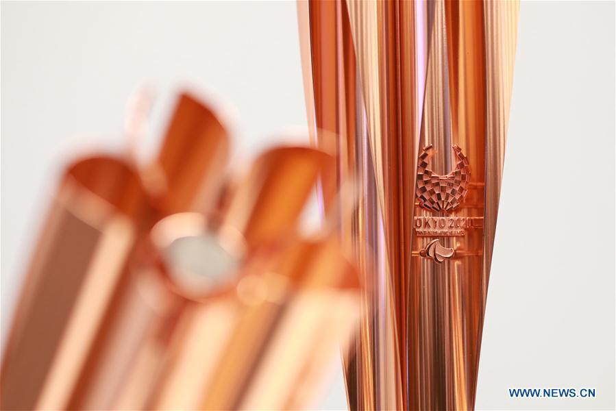 Photo taken in Tokyo, Japan, on March 25, 2019, shows the details of the Tokyo 2020 Paralympic Torch. Tokyo 2020 unveiled the sample of the Tokyo 2020 Paralympic Torch on Monday. The color of Tokyo 2020 Paralympic Torch is cherry blossom pink. Aluminum recycled from temporary housing used in areas struck by the Great East Japan Earthquake disaster will be used to manufacture the torch. (Xinhua/Du Xiaoyi)