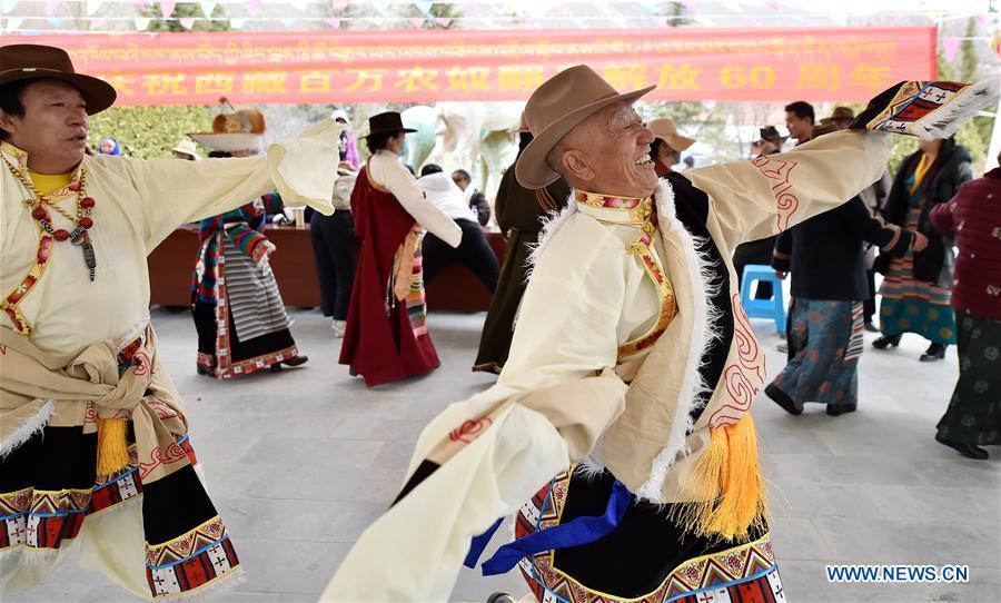 People dance to celebrate the 60th anniversary of democratic reforms in Tibet, at a community in Lhasa, capital of southwest China\'s Tibet Autonomous Region, March 23, 2019. (Xinhua/Chogo)