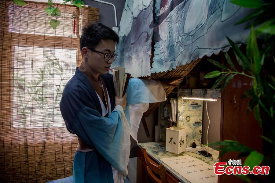 A newly-renovated dormitory room at the Wuhan Textile University Yangguang (Sunny) Campus in Wuhan City, Hubei Province, March 26, 2019. Four students have completely overhauled their dormitory room, decorating it with plastic bamboo trees, traditional window decorations and paintings reflecting Hui-style architecture. The four students are known to don traditional costumes and play Go, imitating the lifestyles of ancient Chinese scholars. (Photo: China News Service/Zhang Chang)