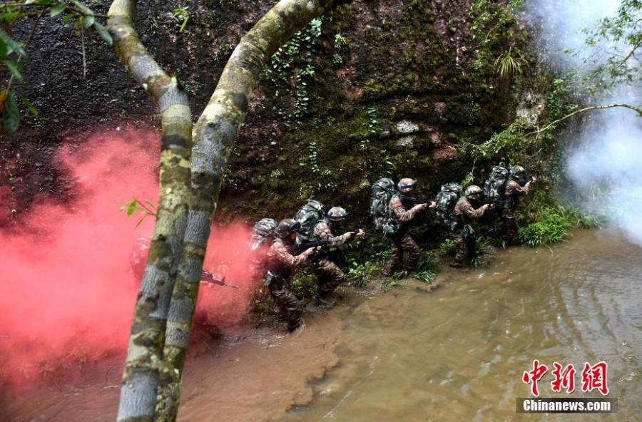 <?php echo strip_tags(addslashes(Armed police undergo intensive training in Sanming City, Fujian Province. The training included challenging search and rescue operations and aimed to enhance preparedness against terrorism. (Photo: China News Service/Zhuang Biao))) ?>