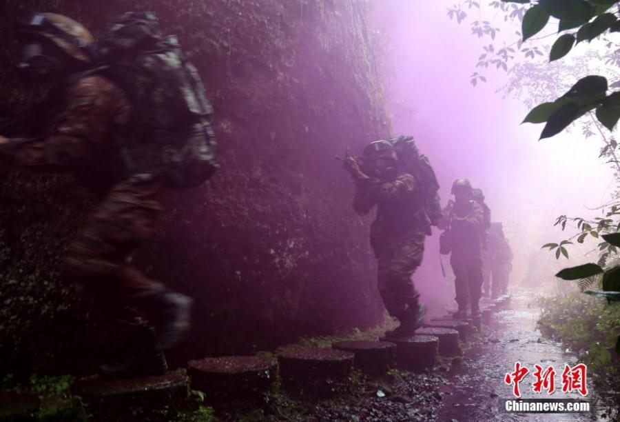<?php echo strip_tags(addslashes(Armed police undergo intensive training in Sanming City, Fujian Province. The training included challenging search and rescue operations and aimed to enhance preparedness against terrorism. (Photo: China News Service/Hu Xin))) ?>