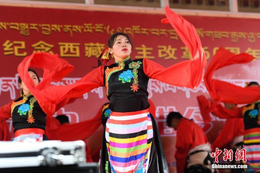 <?php echo strip_tags(addslashes(A performance marks the 60th anniversary of democratic reform in Lhasa, Southwest China's Tibet Autonomous Region, March 27, 2019. Various events, such as the flag-raising ceremony, performances and photo exhibitions to highlight the strides made in six decades, have been held across many areas in the autonomous region.  Thursday marks the 60th anniversary of democratic reform that abolished ruthless theocracy and serfdom, and established a socialist system that has seen booming economic, political, religious, cultural and social development on the plateau. (Photo: China News Service/He Penglei))) ?>