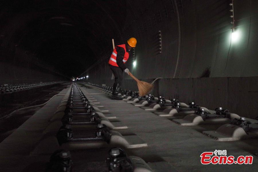 A worker inside the Nankou Tunnel, part of the Beijing-Zhangjiakou High-speed Railway in Changping District, Beijing, March 28, 2019. Construction of the main structure of the tunnel is now complete. The tunnel is 3,032 meters long and has a designed speed of 250 kilometres per hour. The 174-km-long railway is a major transportation project for the 2022 Winter Olympic Games. (Photo: China News Service/Jia Tianyong)