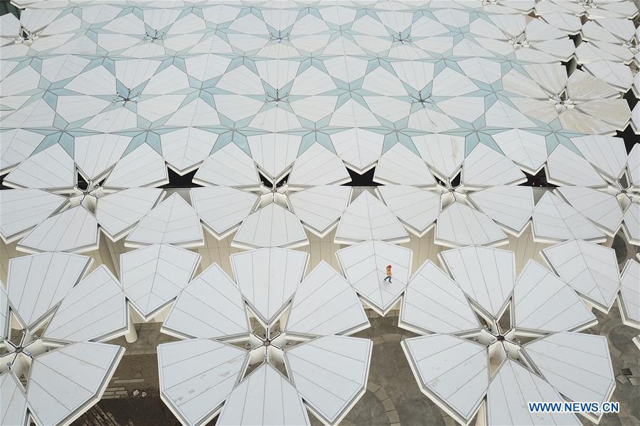 Aerial photo taken on March 26, 2019 shows a worker walking on the roof of the International Pavilion at the site of the International Horticultural Exhibition 2019 Beijing China (Expo 2019 Beijing) in Yanqing District of Beijing, capital of China. The 2019 Beijing International Horticultural Exhibition is slated to kick off on April 29, 2019. (Xinhua/Zhang Haofu)