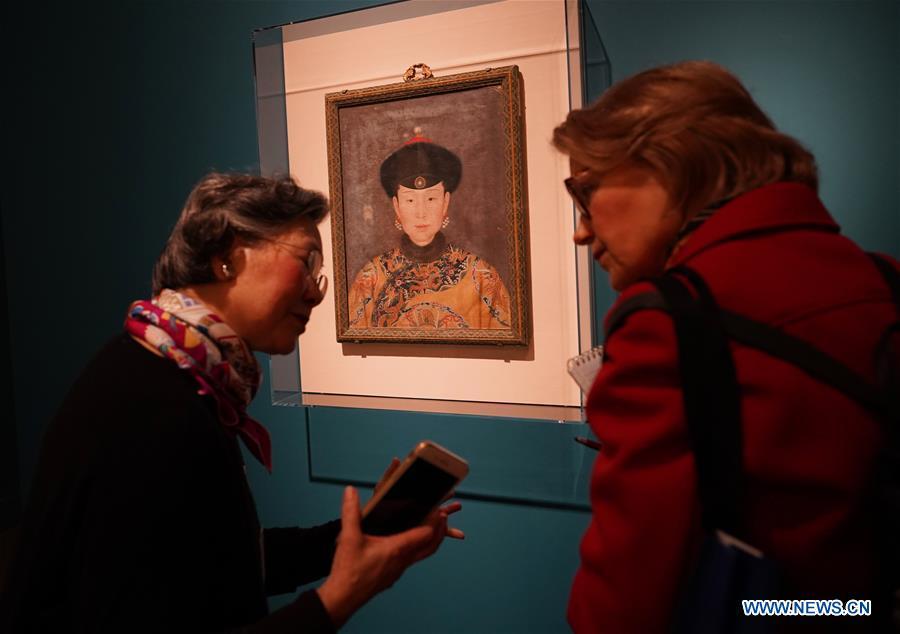 People visit the exhibition titled \