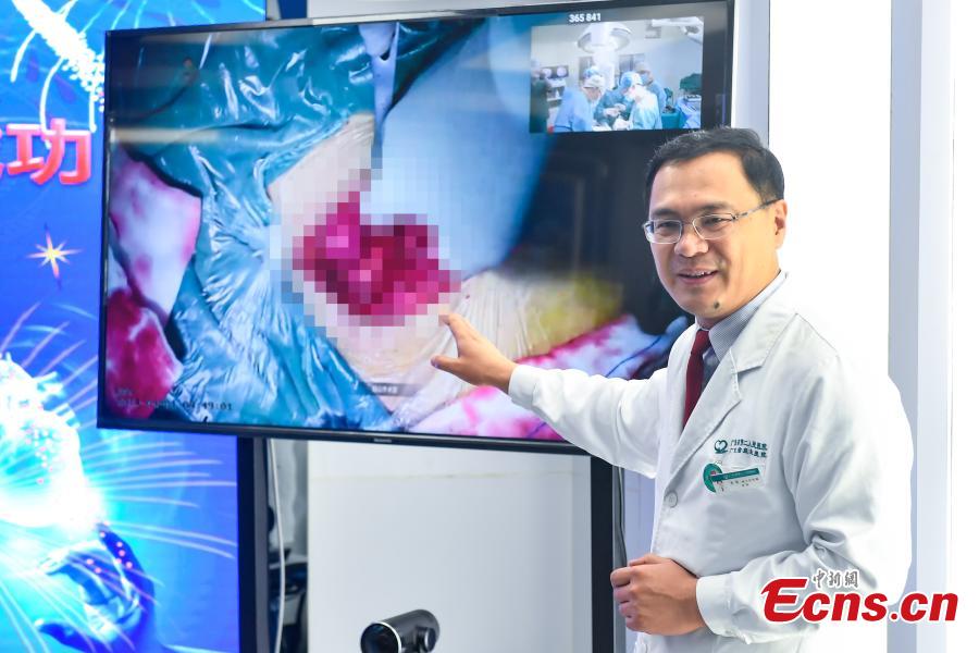 <?php echo strip_tags(addslashes(Doctor Qi Yong at the Second People's Hospital in Guangdong Province supervises a surgery at Yanshan Hospital through a 4K UHD live broadcast via 5G, April 1, 2019. (Photo: China News Service/Zhong Xin))) ?>