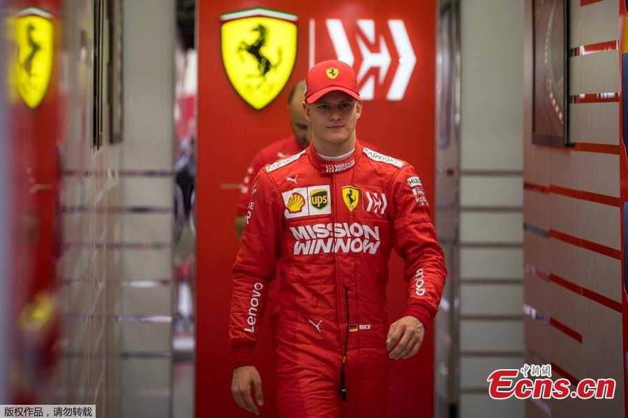 German Formula 2 driver Mick Schumacher walks out of Scuderia Ferrari offices during his first Formula One testing at the Sakhir circuit near Manama, Bahrain, Apr. 2, 2019.  (Photo/Agencies)