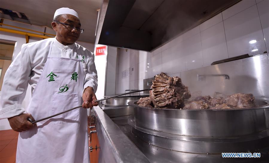 <?php echo strip_tags(addslashes(A chef gets noodles from a pot at a beef noodle restaurant in Lanzhou, capital of northwest China's Gansu Province, April 2, 2019. Lanzhou beef noodles, a Chinese hand-pulled noodle originated in Lanzhou, has a history of about 100 years. There are about ten types of noodles of different width and shapes, depending on noodle chefs' pulling skills. It has won fame both at home and abroad with its speciality of noodles and soup recipe. (Xinhua/Fan Peishen))) ?>