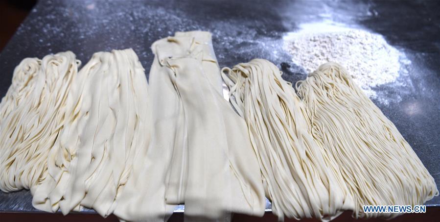 <?php echo strip_tags(addslashes(Photo taken on April 2, 2019 shows the noodles of different width at a beef noodle restaurant in Lanzhou, capital of northwest China's Gansu Province. Lanzhou beef noodles, a Chinese hand-pulled noodle originated in Lanzhou, has a history of about 100 years. There are about ten types of noodles of different width and shapes, depending on noodle chefs' pulling skills. It has won fame both at home and abroad with its speciality of noodles and soup recipe. (Xinhua/Fan Peishen))) ?>
